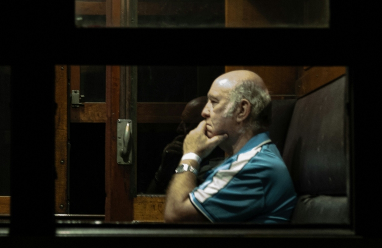 man through window