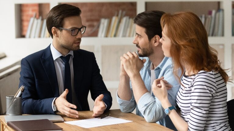 young couple is consulting with lawyer about divorce