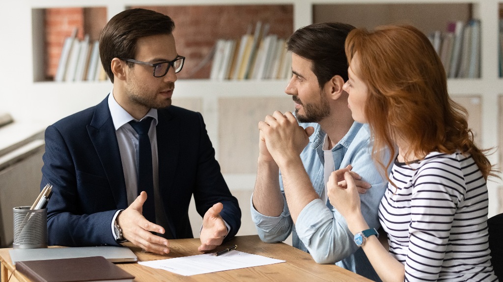 young couple is consulting with lawyer about divorce