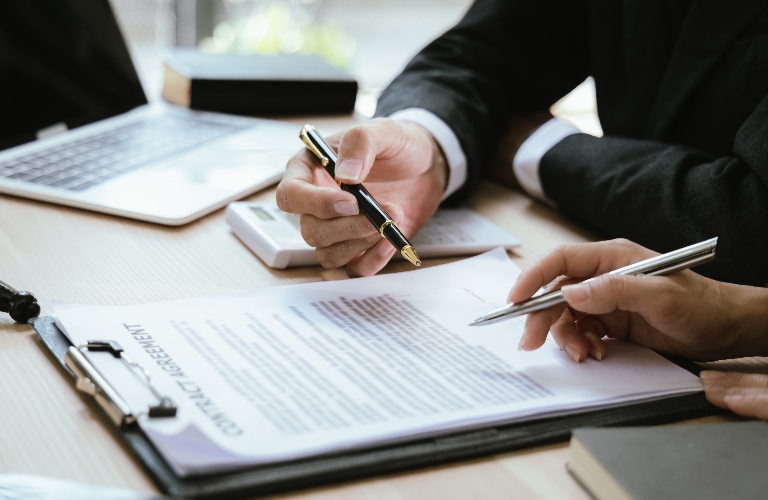 Lawyer and client are reviewing documents