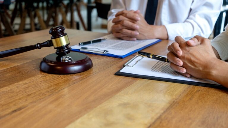 In the law firm, husband and wife signing in legal separation document, marriage law lawyer